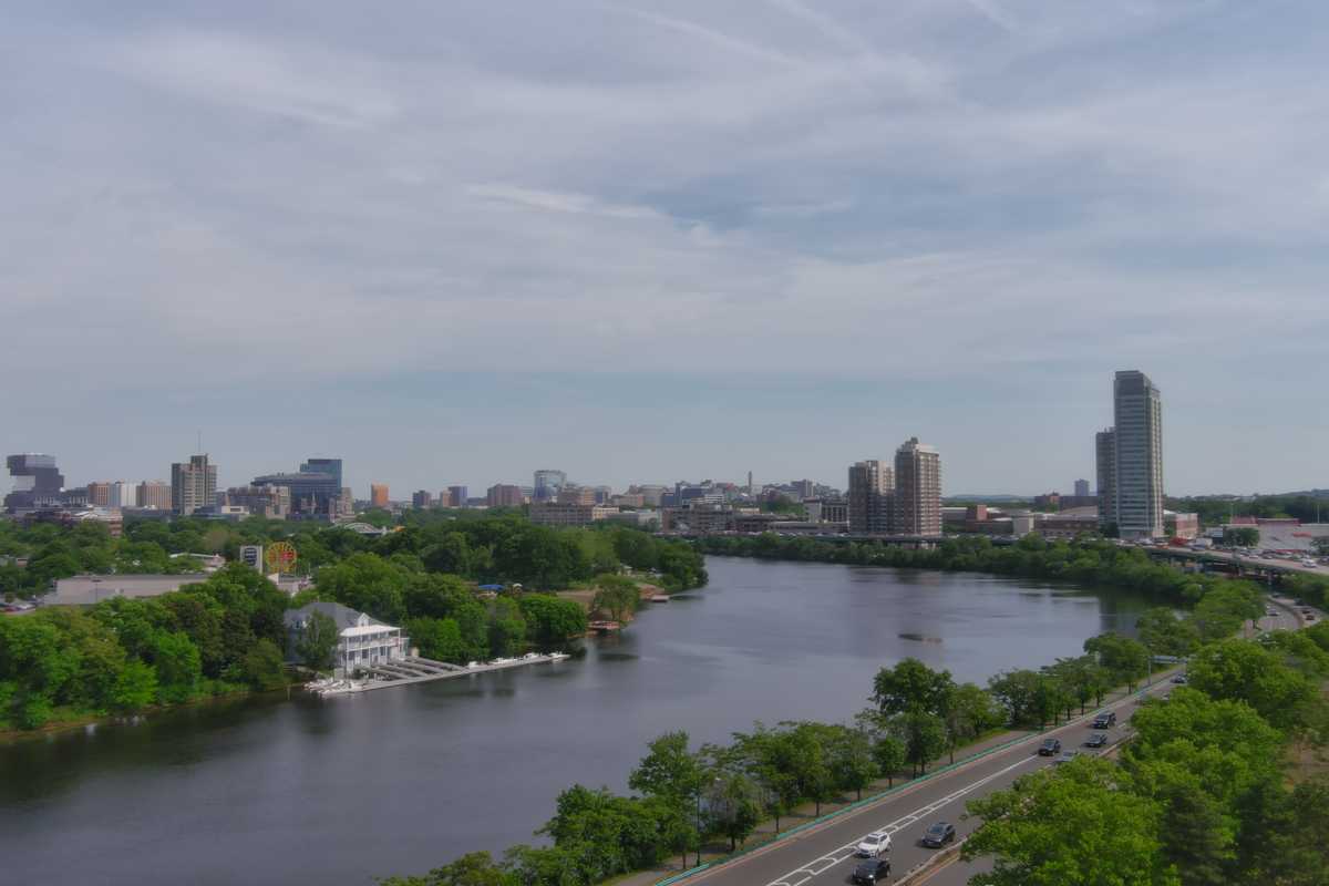 Aerial view of the Boston skyline across the Charles River on a summer afternoon
